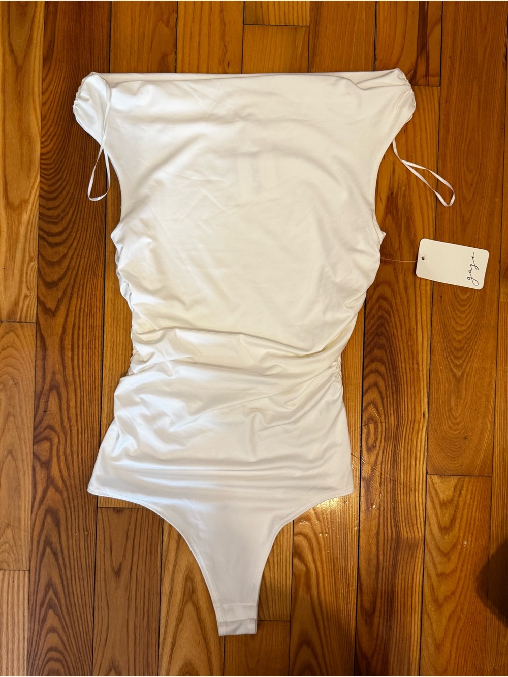 White off the shoulder bodysuit. New with tags